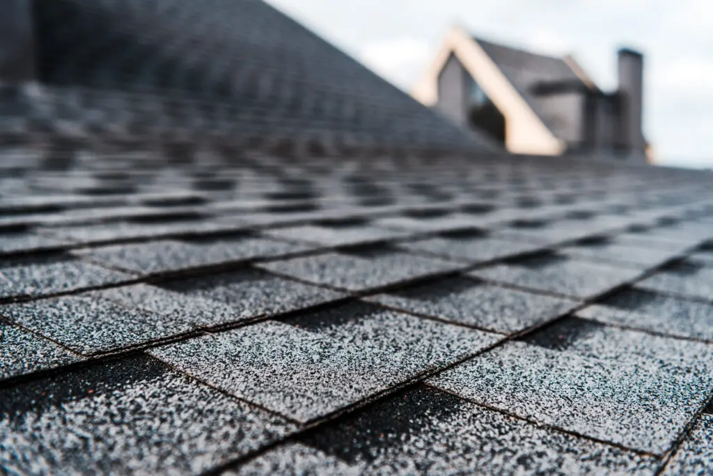 shallow depth photo of asphalt roof shingles
