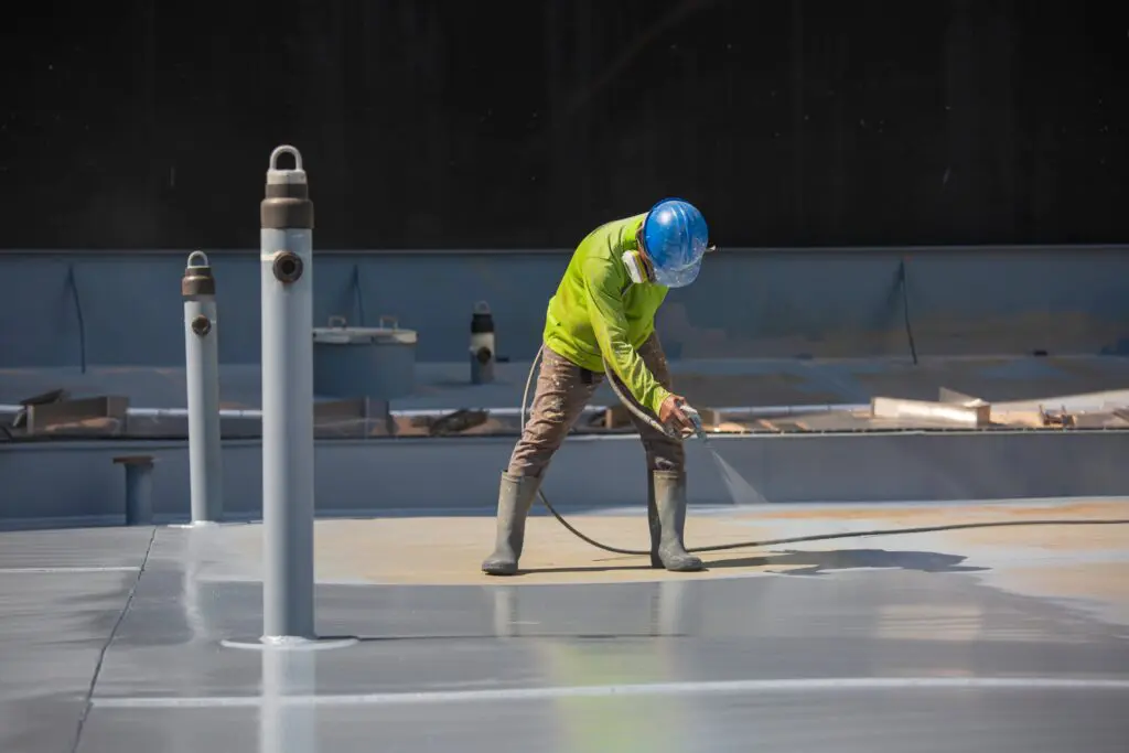 contractor working on commercial flat roofing system