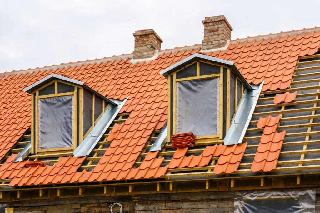 clay tile roof with dormer windows on residential home