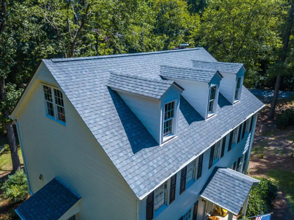 residential home with new roof and dormer windows