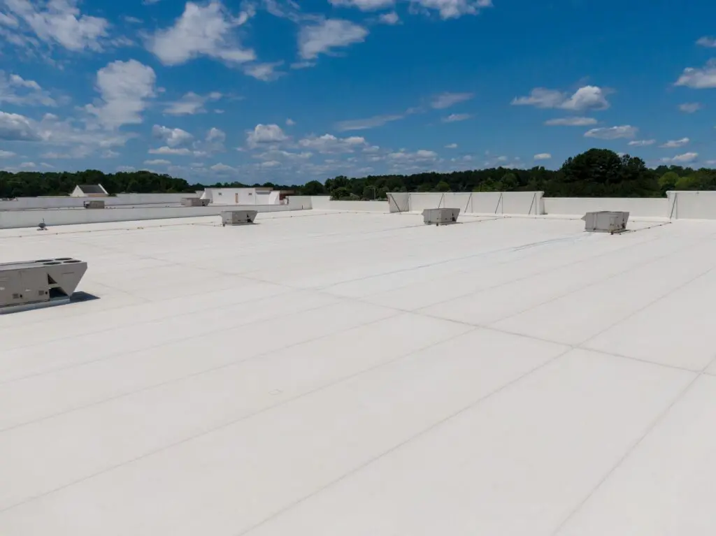 commercial flat roof with white membrane surface