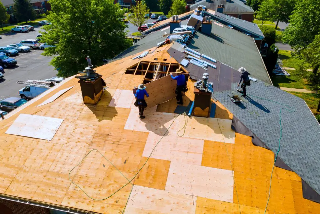 roofing crew installing new roof on residential home in Omaha, NE
